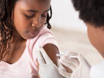child receiving a vaccination child receiving a vaccination