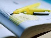 EMS Curricula and Course Approval Photo of a text book and highlighter