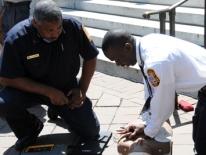 Members of DC Fire & EMS perform CPR