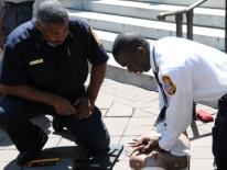Members of DC Fire & EMS perform CPR Members of DC Fire & EMS perform CPR